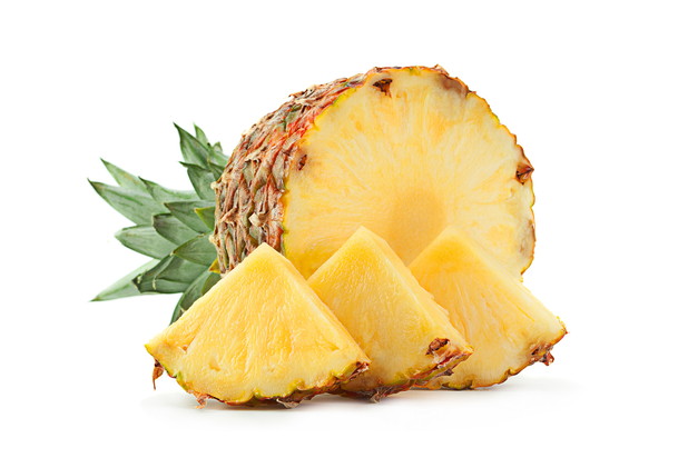 Ripe Pineapple tropical fruit closeup isolated on white